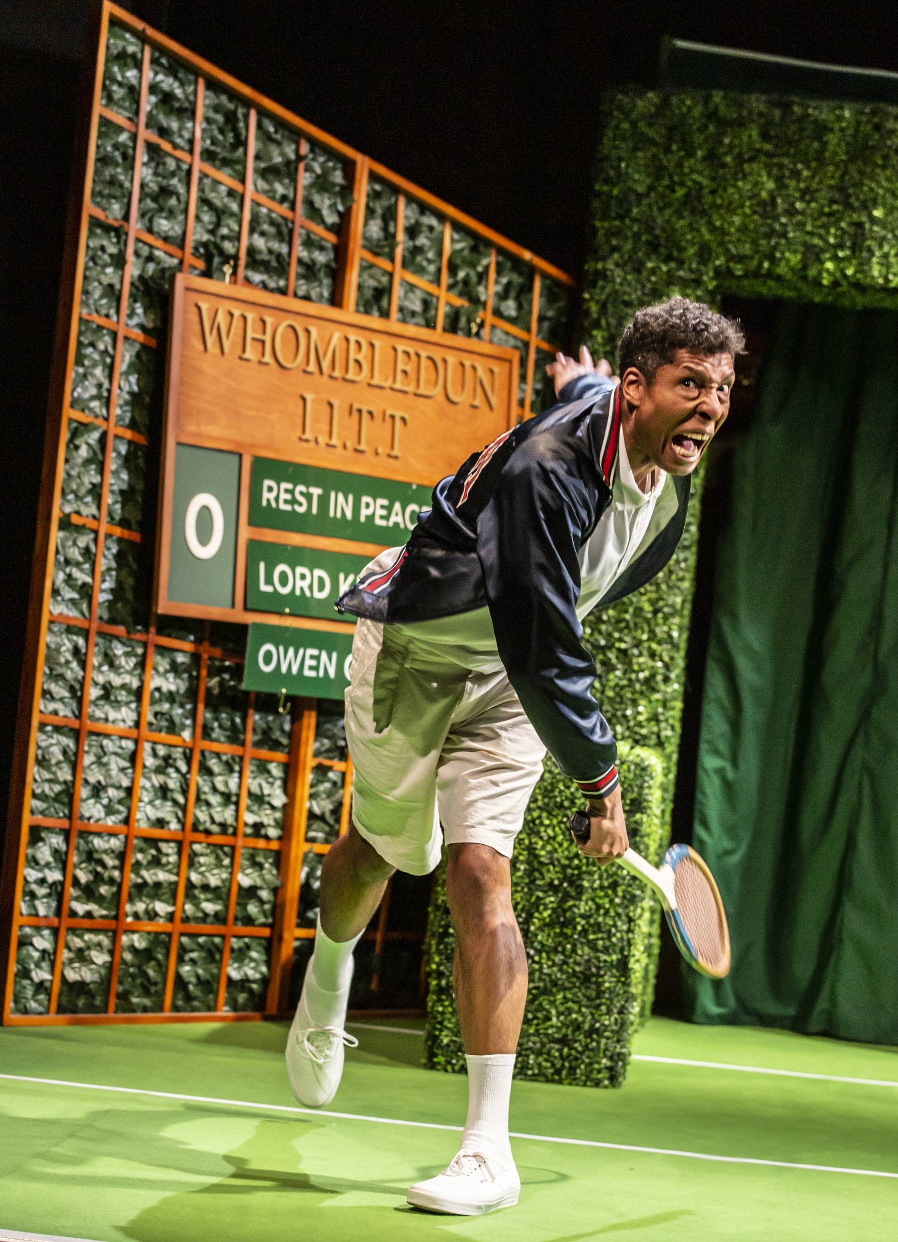 A male character playing a competitive game of tennis.