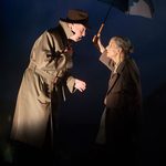 old man standing under umbrella, old women standing and holding umbrella