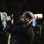 Sound Technician adjusts levels on a computer monitor