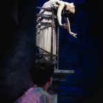 Juliet (Saeka Shirai) hangs backwards over balcony as Romeo (Harris Beattie) looks up at her