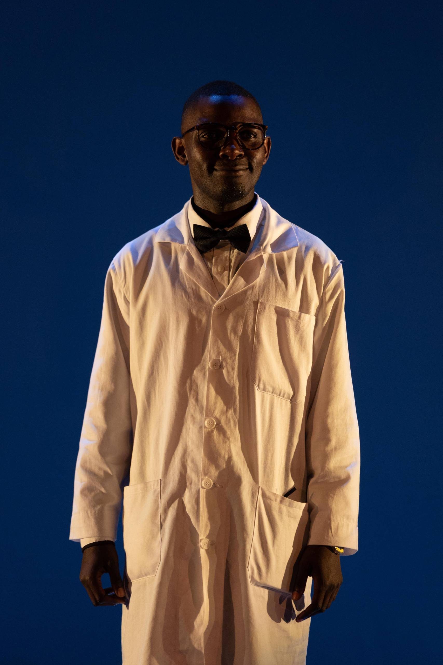 One male character wearing a lab coat and bow tie.