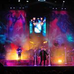 Anything For Love stage, gothic backdrop and chandelier, musicians and three black clad singers