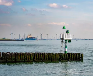 A cargo ship leaving a harbour