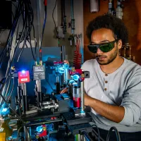 Performing experimental study of optical phase change materials using lasers to switch their response between crystalline and amorphous states.